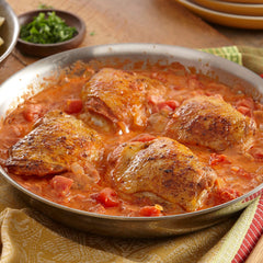 McCormick Gourmet Hot Hungarian Paprika color glow over a simmering dish