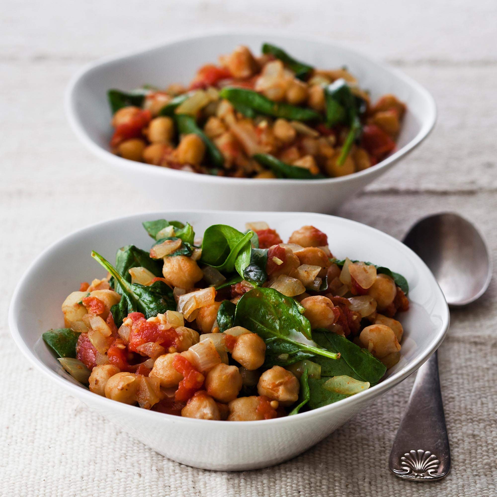 Curry vinaigrette made with McCormick Gourmet Organic Curry Powder over a bright salad.