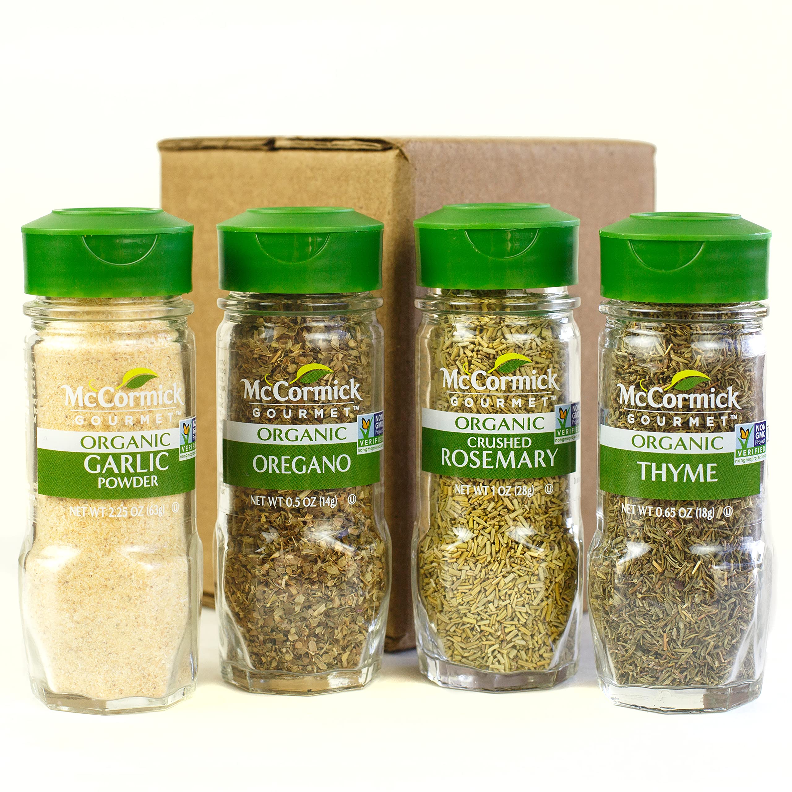 McCormick Gourmet Organic herbs shown ready to flavor roasted chicken and vegetables