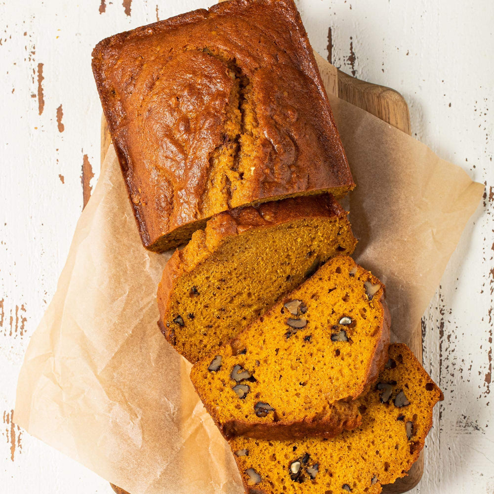 McCormick Gourmet Organic Ground Ginger dusted over pumpkin pie batter, adding floral warmth.