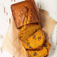 McCormick Gourmet Organic Ground Ginger dusted over pumpkin pie batter, adding floral warmth.