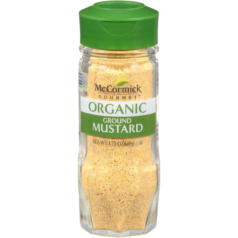 McCormick Gourmet Organic Ground Mustard bottle pour adds bold heat to sauces.
