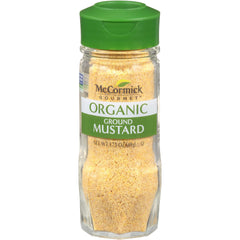 McCormick Gourmet Organic Ground Mustard bottle pour adds bold heat to sauces.
