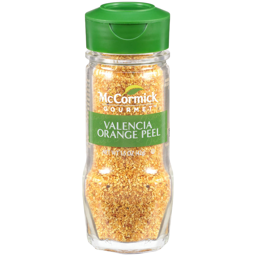 McCormick Gourmet Valencia Orange Peel bottle pour showing citrus zest ready to blend