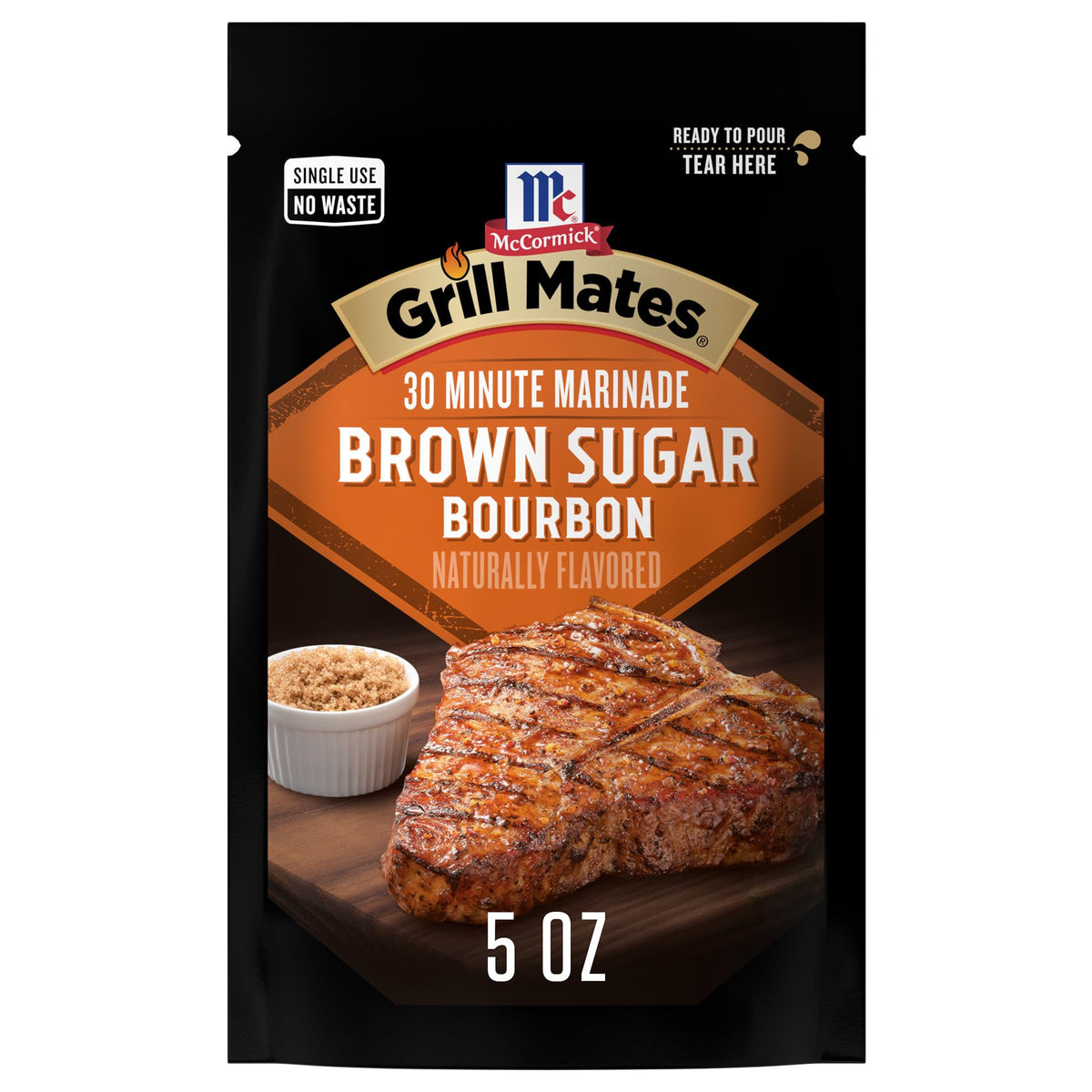 McCormick Grill Mates Brown Sugar Bourbon marinade bottle poured over chicken for quick flavor