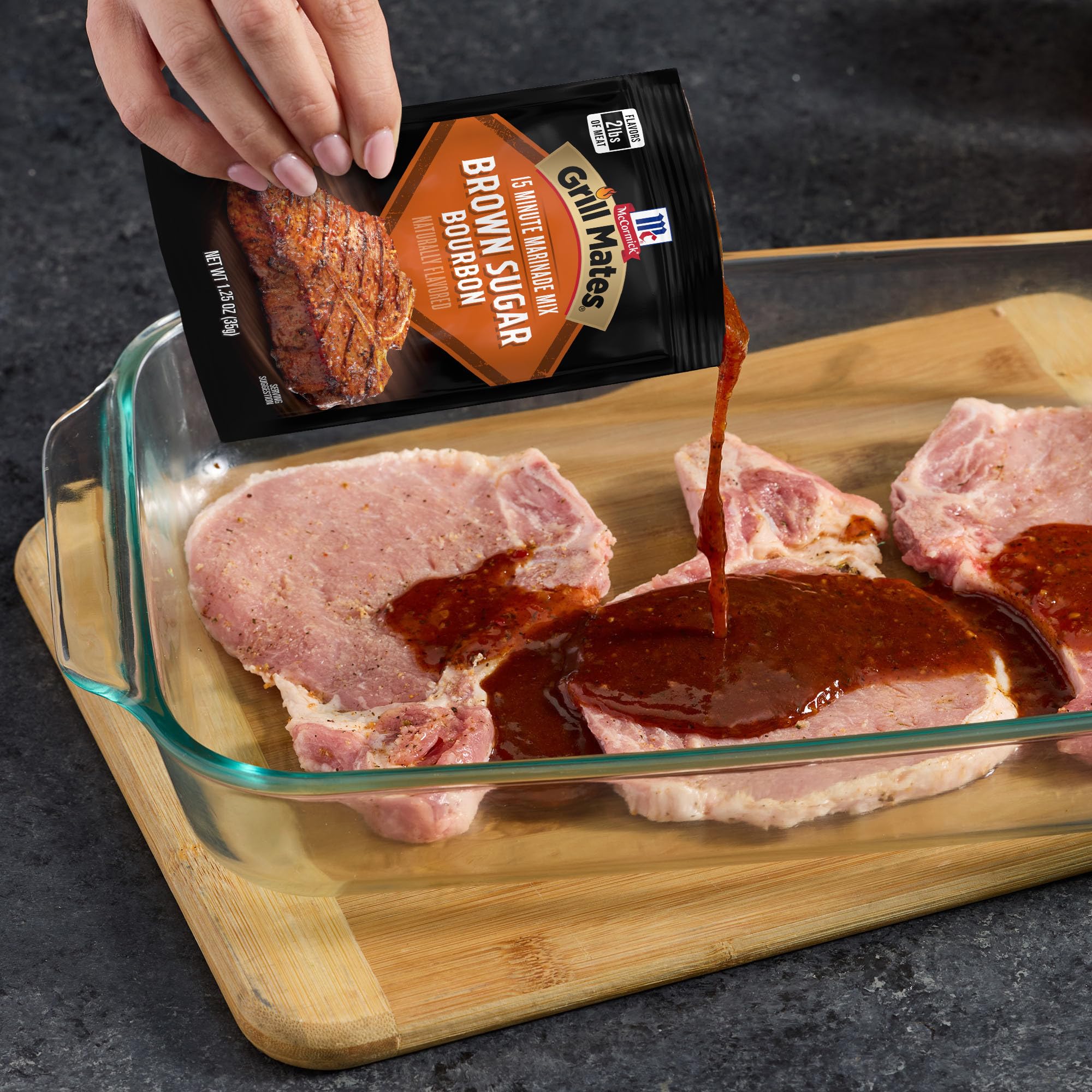 McCormick Grill Mates Brown Sugar Bourbon seasons a raw steak before grilling