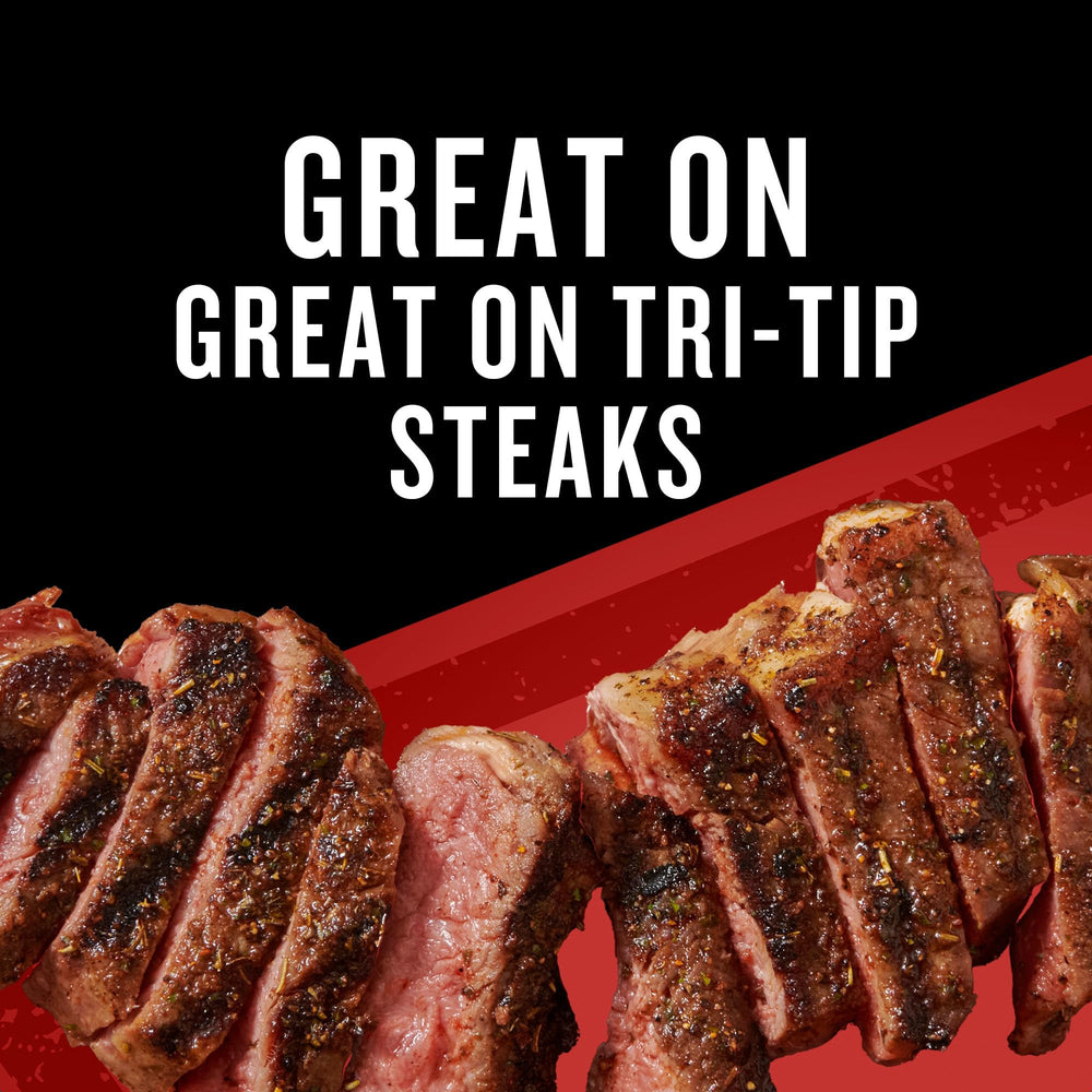 Stovetop skillet sizzling with seasoned beef and rub