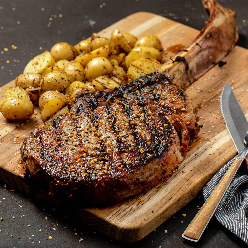 Shaker canister of McCormick Grill Mates Cracked Pepper & Garlic for easy coating