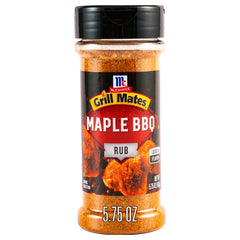 McCormick Grill Mates Maple BBQ Rub bottle pouring onto chicken for a flavorful crust