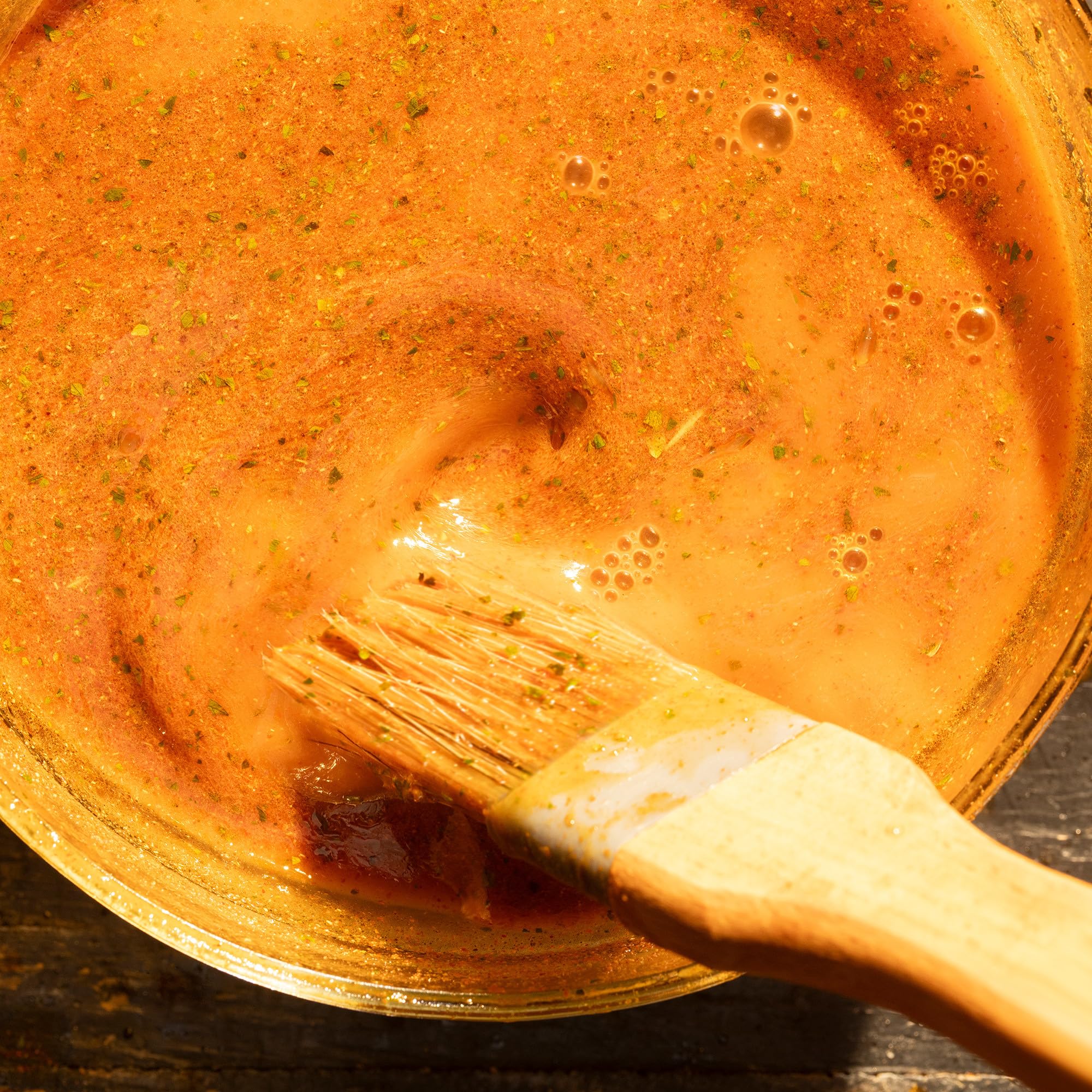 Grill-ready meats bathed in Mesquite Marinade Mix aroma as they sizzle.