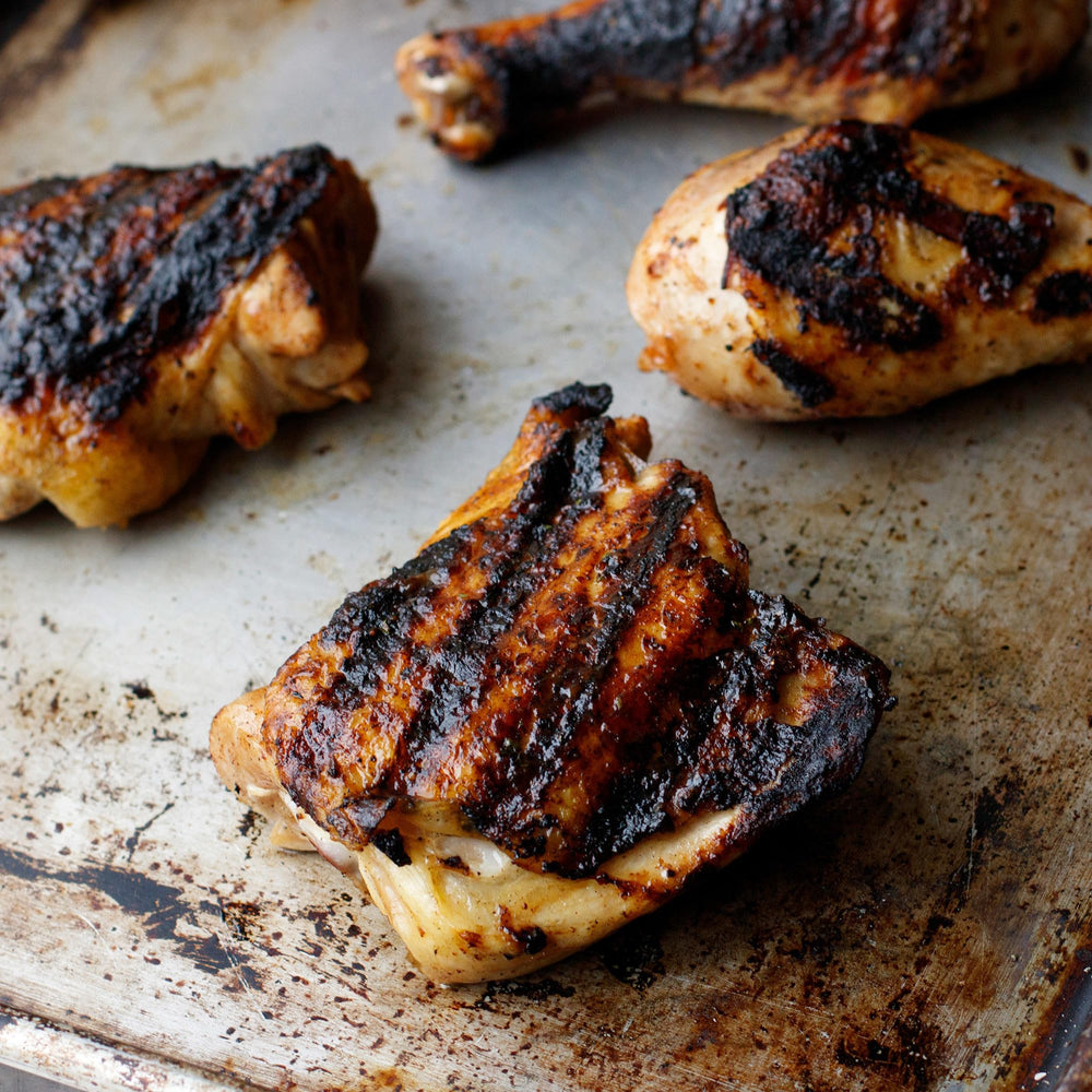 Chicken breasts marinated with Mesquite spice for savory outdoor cooking.
