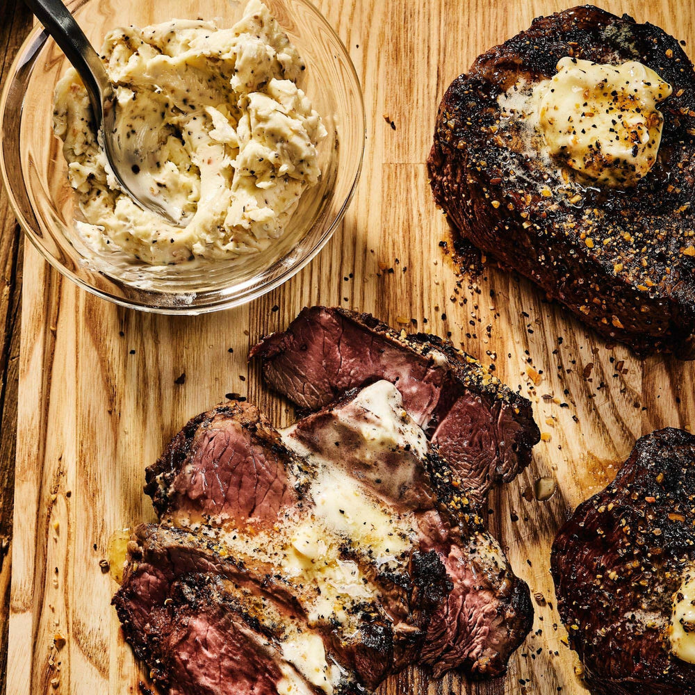 McCormick Grill Mates Montreal Steak Seasoning shaker on counter adds robust flavor to steaks.