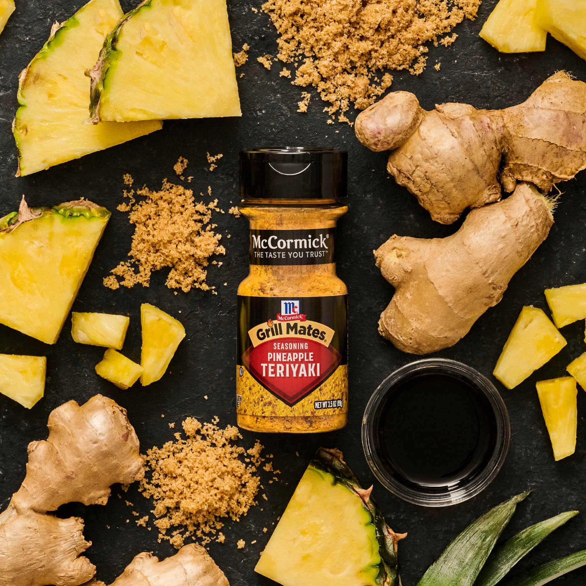 McCormick Grill Mates Pineapple Teriyaki bottle beside grill for easy use