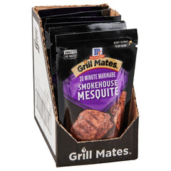 McCormick Grill Mates Smokehouse Mesquite bottle being poured for bold grilling flavor.