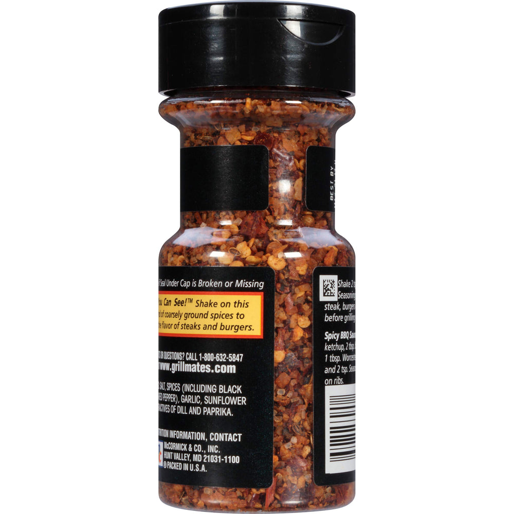 McCormick Grill Mates Spicy Montreal Steak shaker top releasing bold seasoning for bold flavor at the grill.