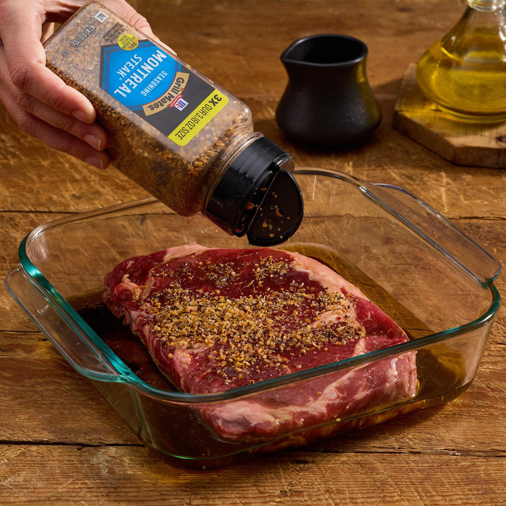 Steak on the grill with Montreal seasoning sizzle.