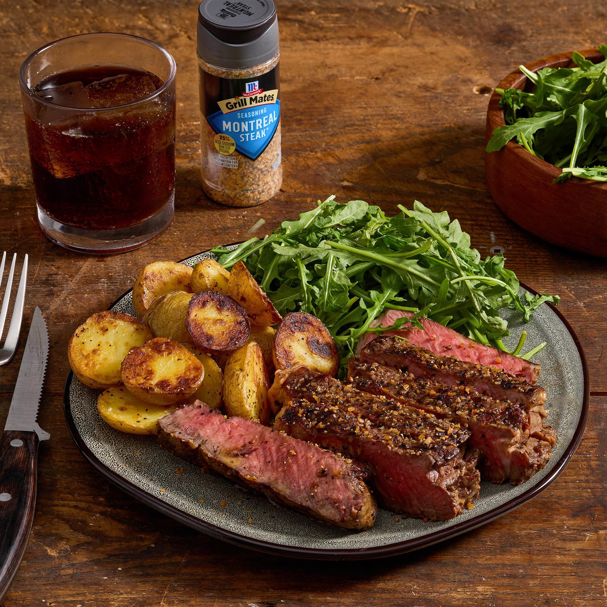 Sizzling steak on the grill using Montreal seasoning highlights flavor potential.