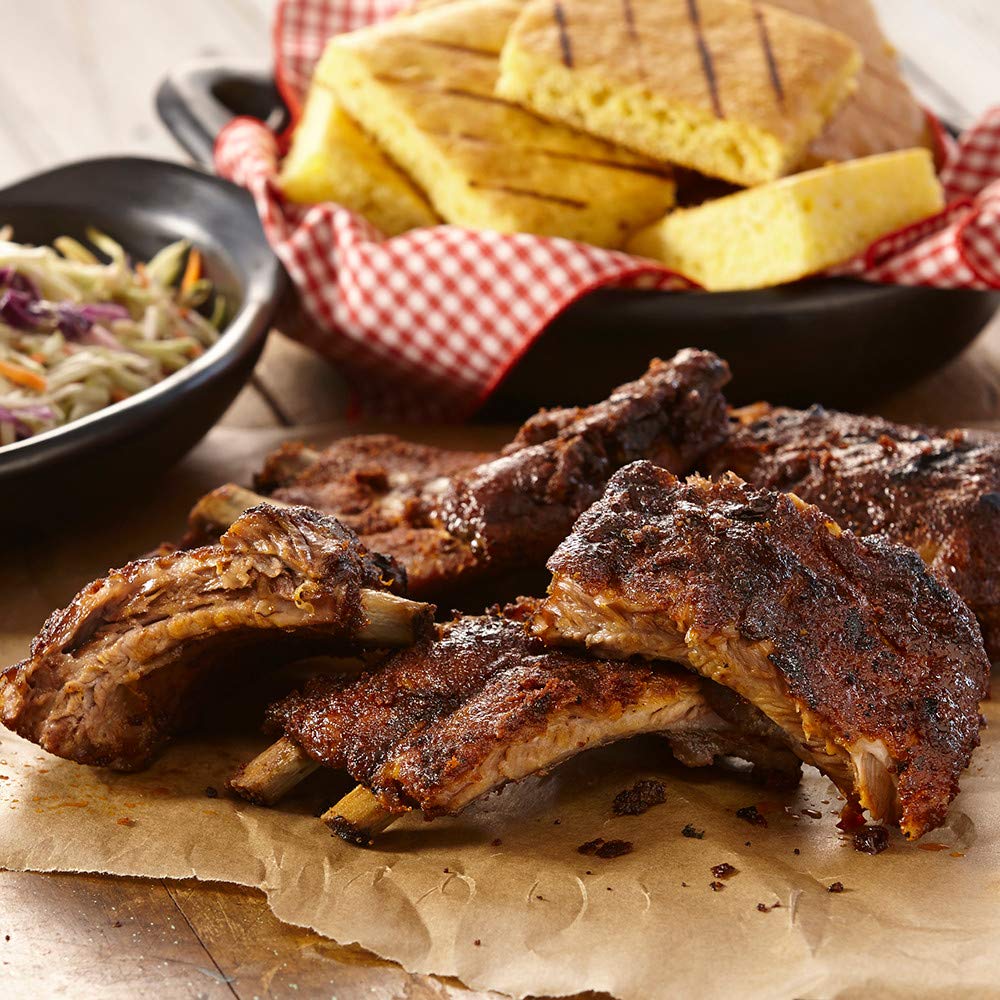 McCormick Grill Mates Sweet & Smoky Rub marination-ready bottle beside ribs.