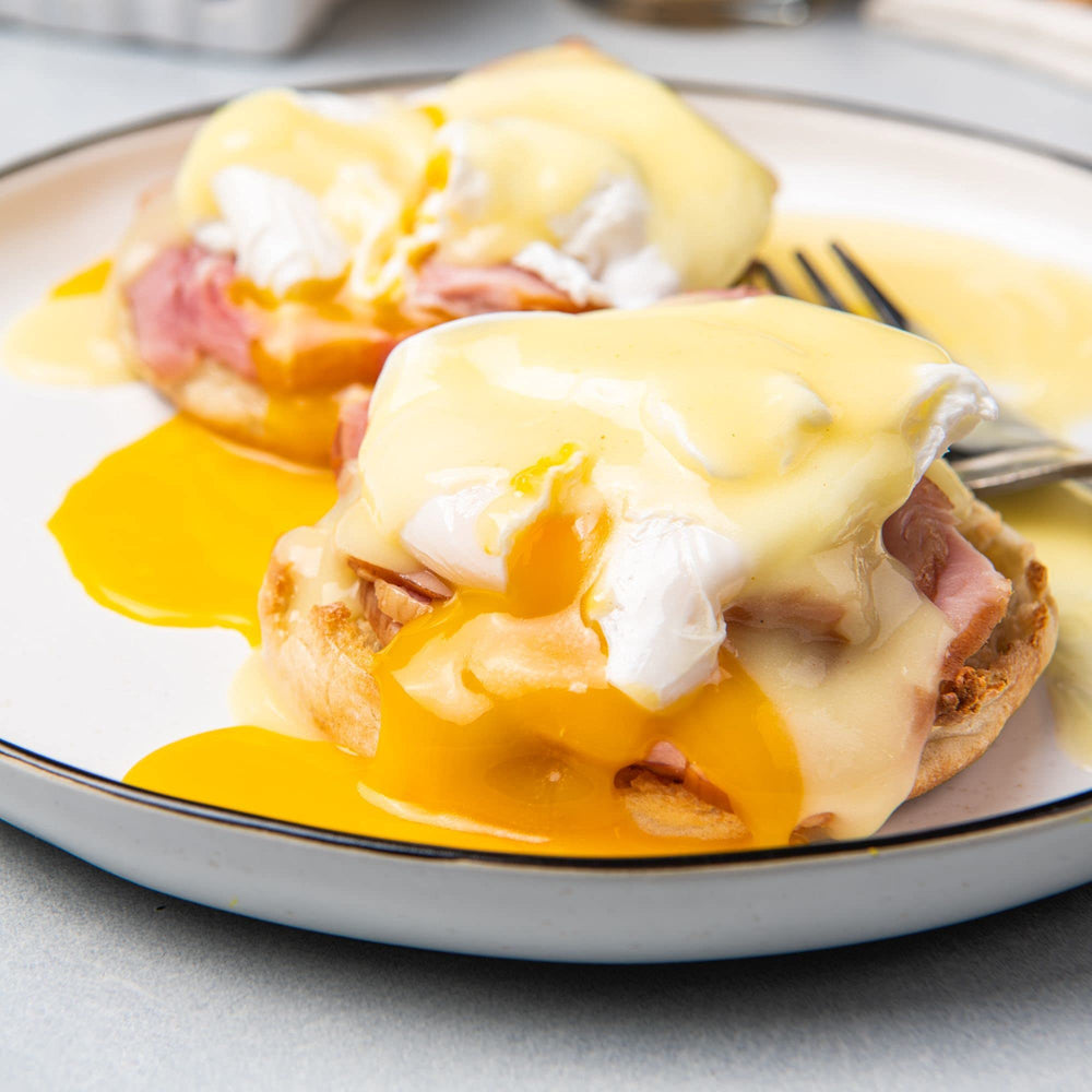 McCormick Hollandaise sauce mix drizzled over asparagus for a glossy finish