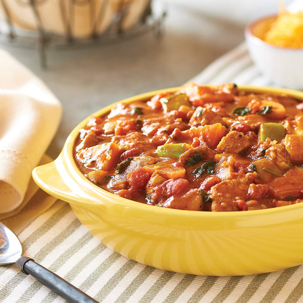 McCormick Hot Chili Seasoning Mix spooned into chili for flavor lift.