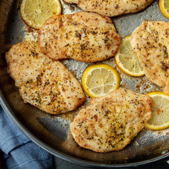 McCormick Lemon & Pepper on seafood dish enhancing aroma and flavor.