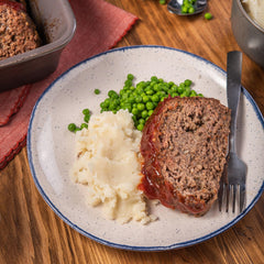 McCormick Meat Loaf Seasoning Mix measuring spoon setup, quick prep.