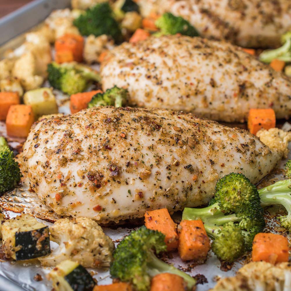 Sizzling chicken with McCormick ONE on a sheet pan.
