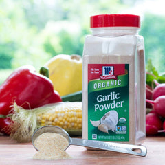 Refill bottle of McCormick Organic Garlic Powder ready to top up jars.