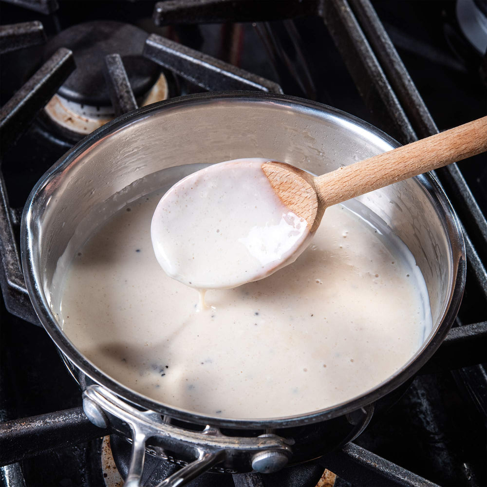 Serving biscuits with McCormick Original Country Gravy Mix gravy topping.