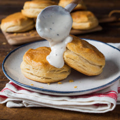 Simmering McCormick Original Country Gravy Mix for rich, lump-free results.