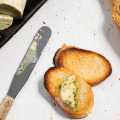 McCormick Parsley Flakes sprinkled on potatoes for color and mild flavor