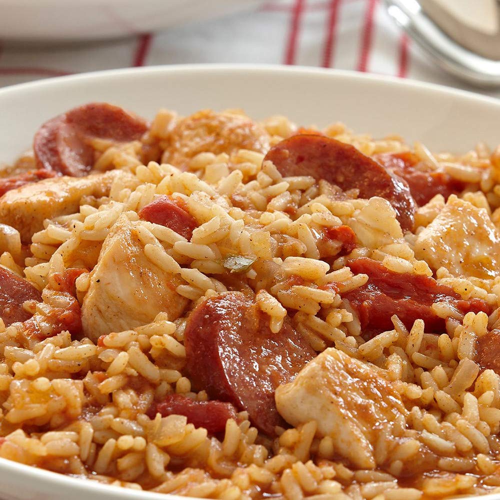 McCormick Perfect Pinch Cajun Seasoning poured over shrimp for a spicy kick