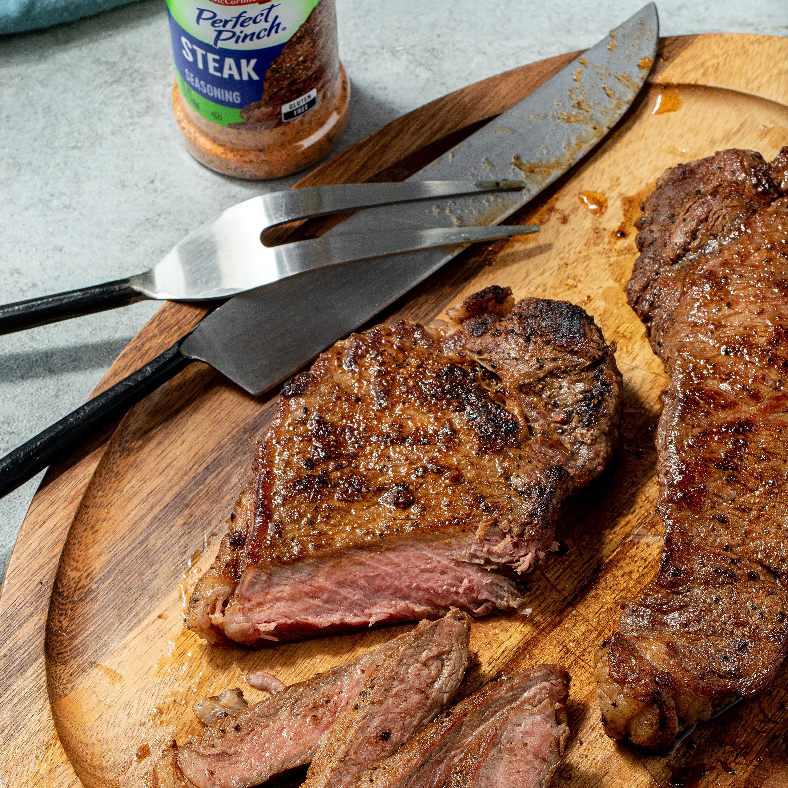 McCormick Perfect Pinch steak seasoning bottle on counter.