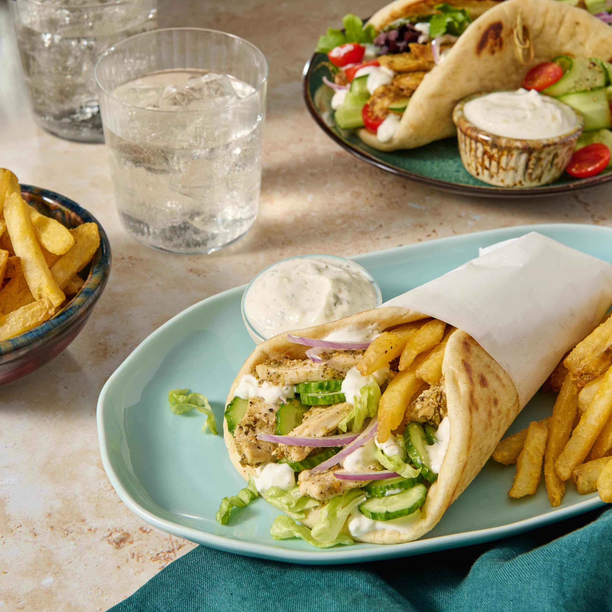 Pita bread being wrapped with McCormick gyro filling for a complete meal.