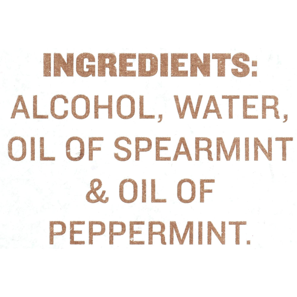Gluten-free and non-GMO labeling on the McCormick mint extract bottle.