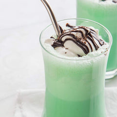 Close-up of spearmint and peppermint oil blend in McCormick extract label.