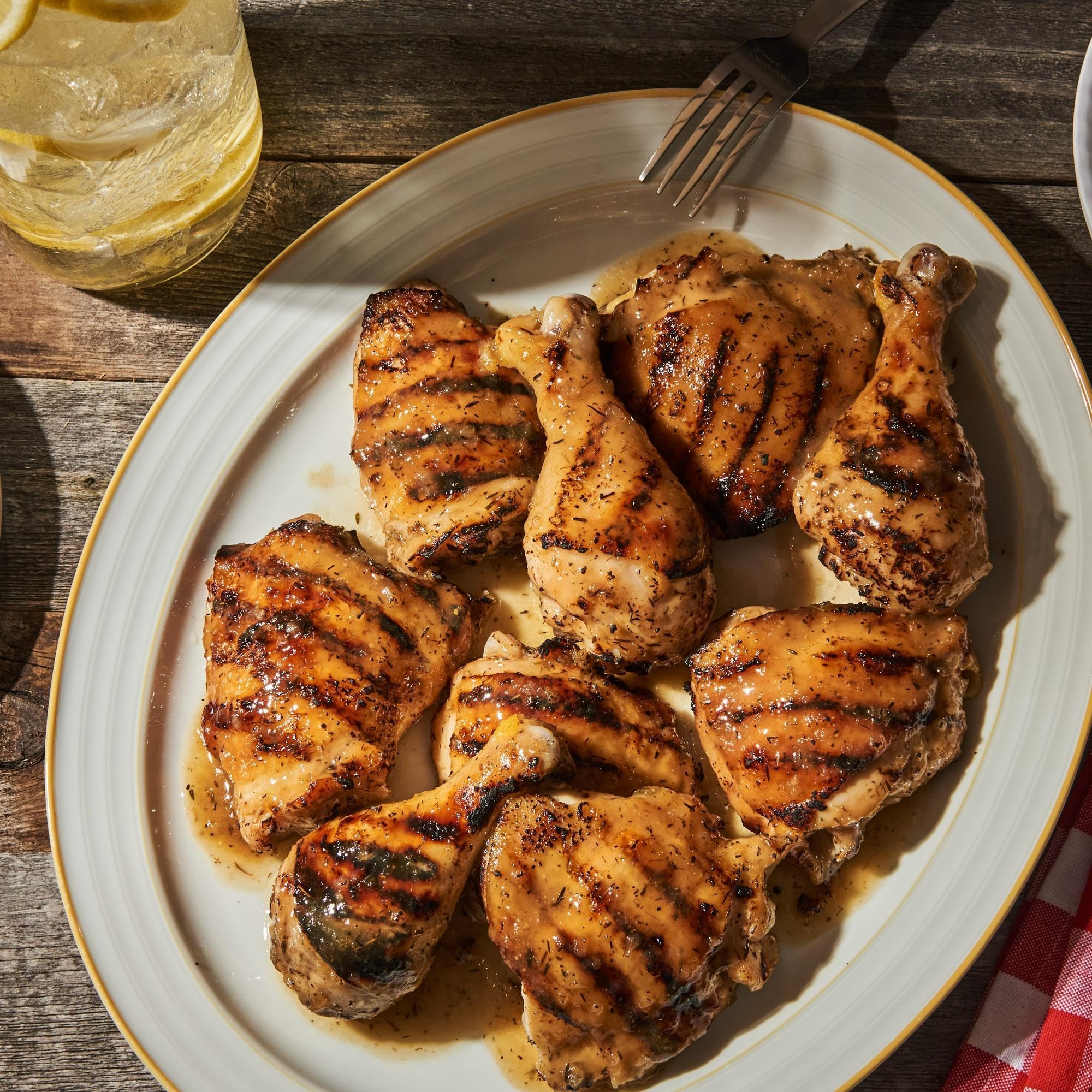 Sprinkling McCormick Rubbed Sage on roast turkey for warm aroma
