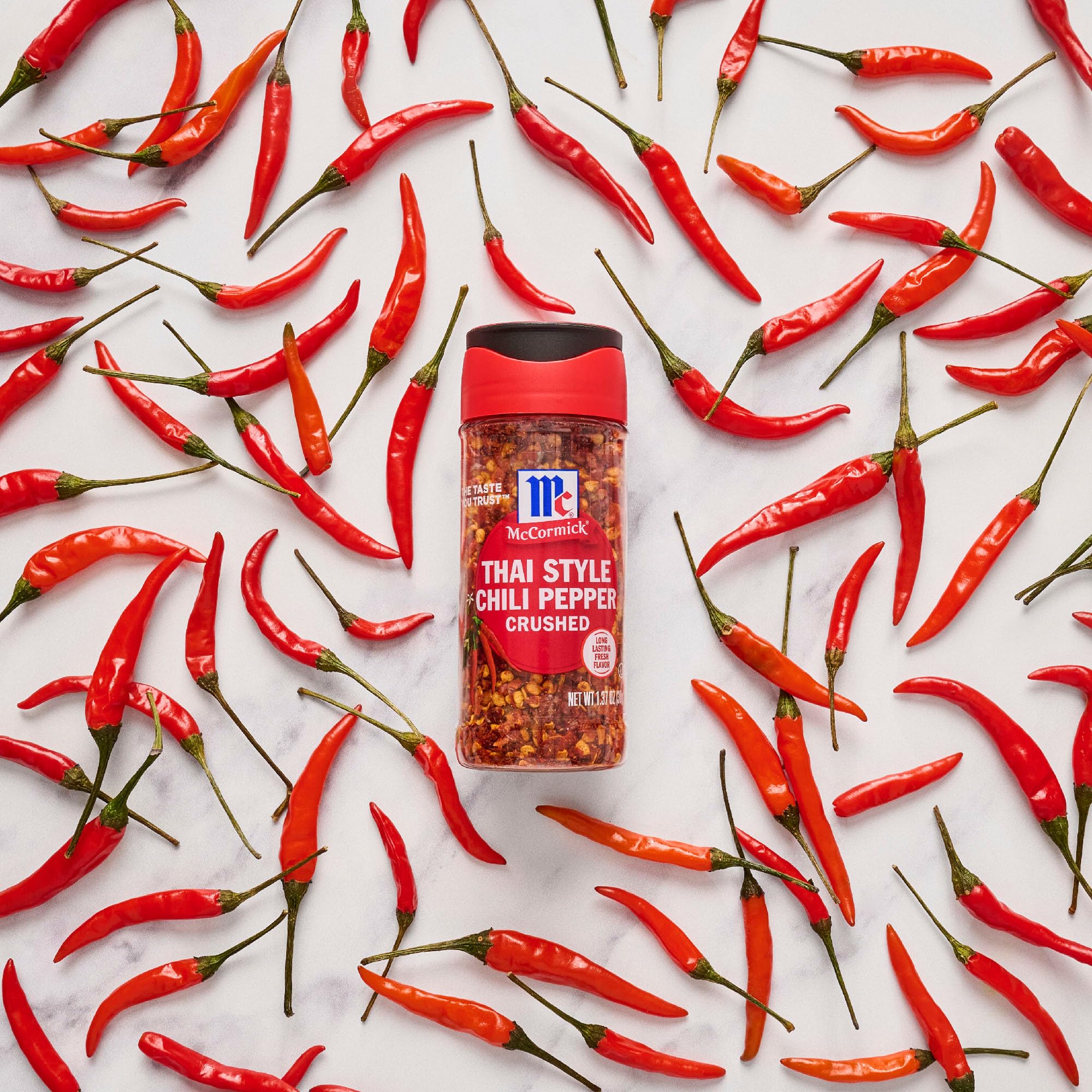 McCormick Thai Style Crushed Chili brightening green papaya salad flavor.