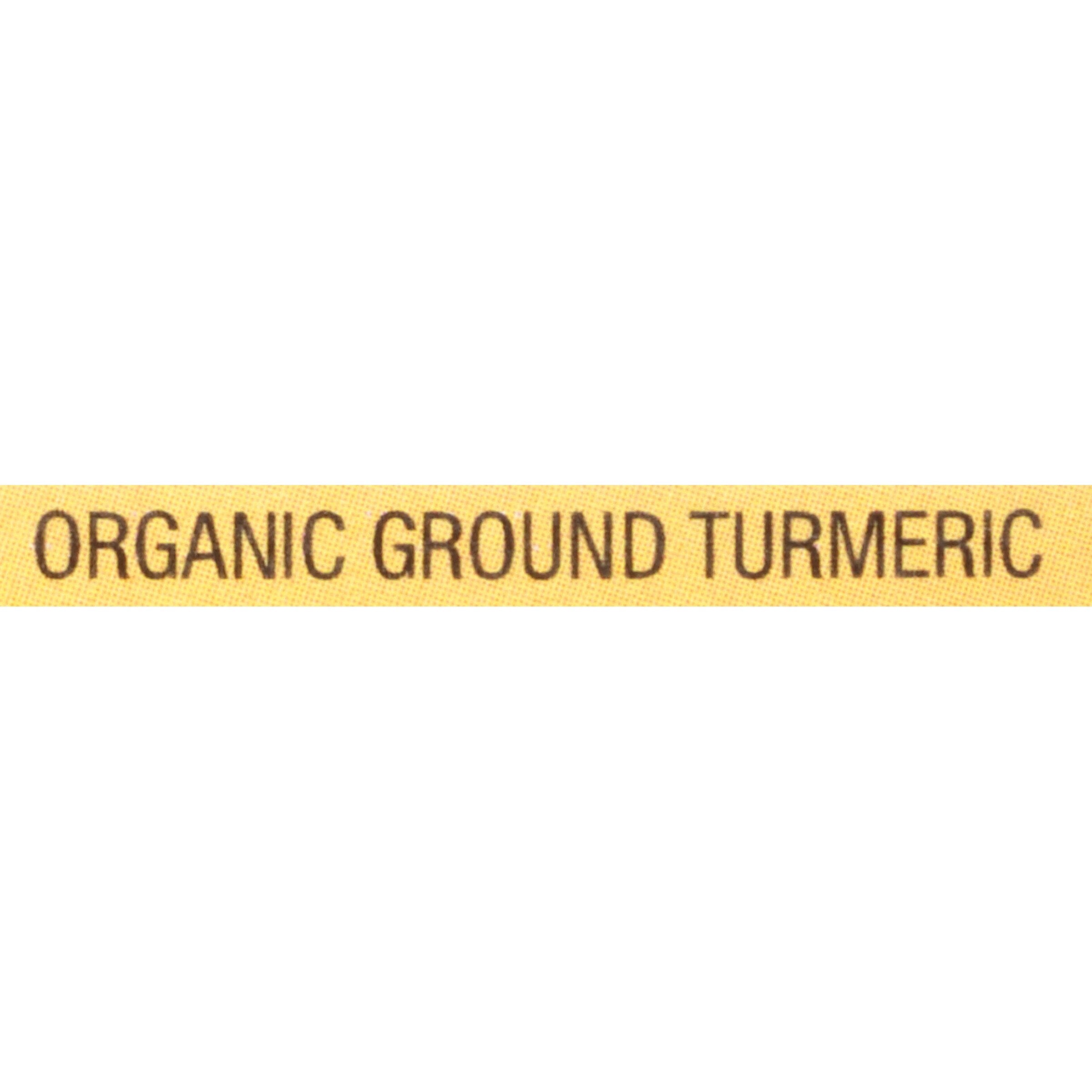 Spoon of McCormick Turmeric color powder enhancing a dish