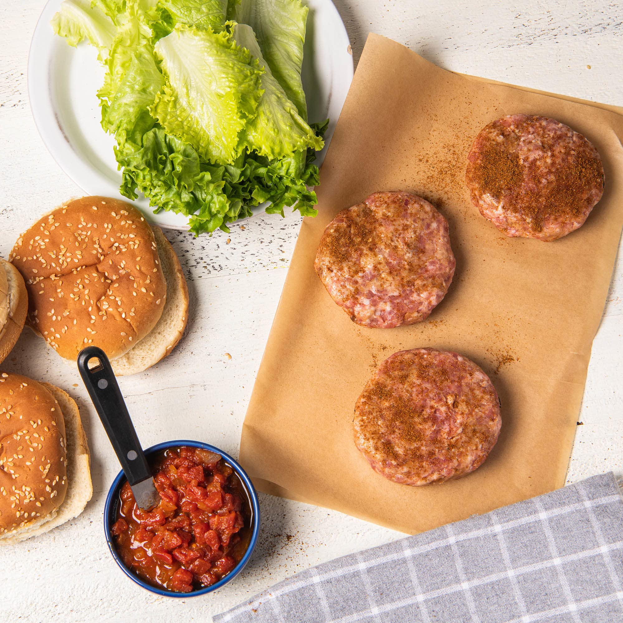 McCormick Umami Seasoning rubbed on burgers for a flavorful crust.