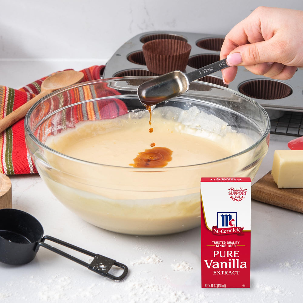 McCormick Vanilla Extract enriching cake with fragrant notes.