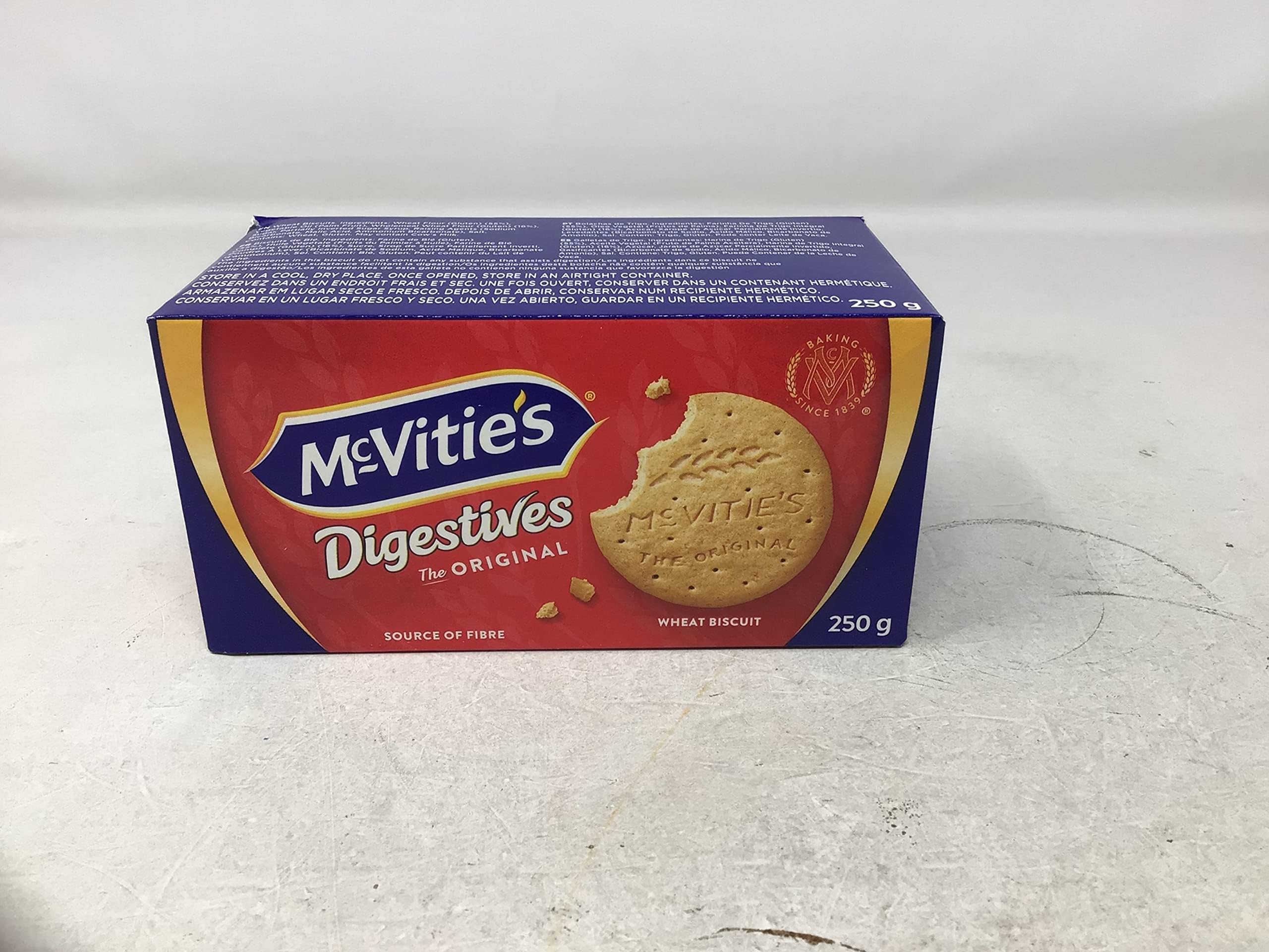 Four McVities Digestives Wheat Biscuits boxes arranged for sharing