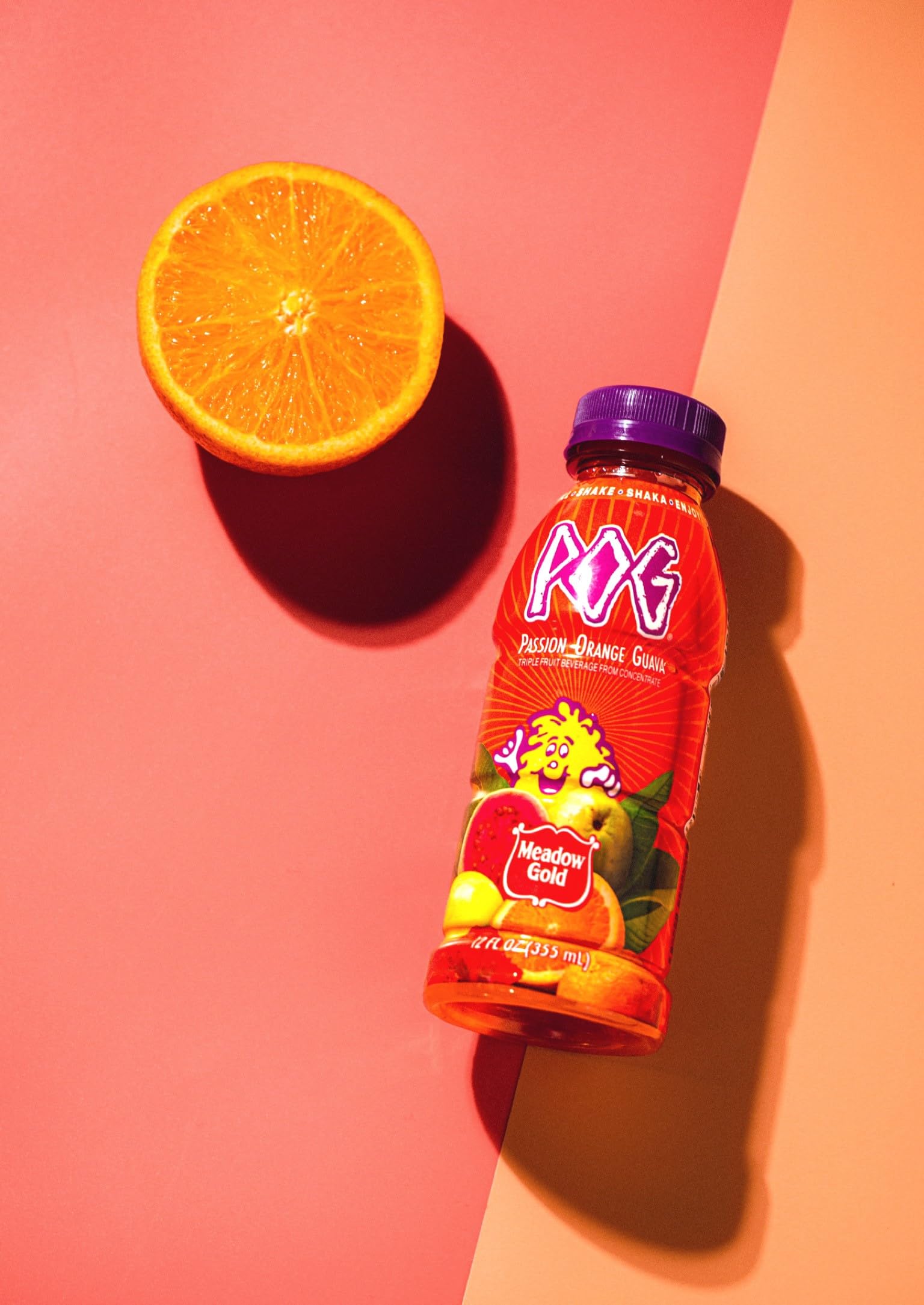 Meadow Gold Pog Juice 12oz bottle with tropical aroma, ideal for on-the-go refreshment.