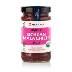 Mekhala Sichuan Mala paste bottle close-up showing spicy flavor booster.
