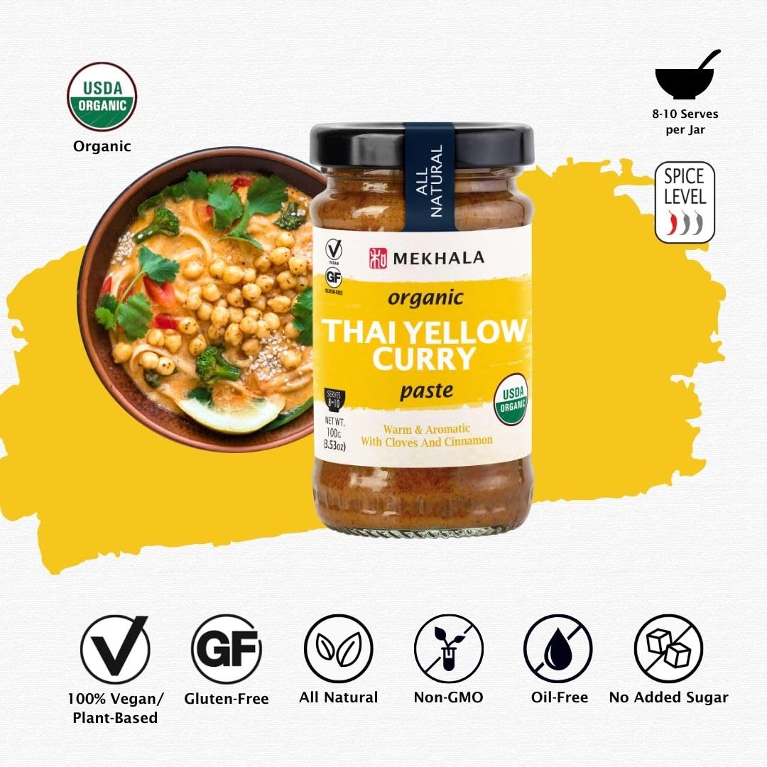 Close-up of Mekhala Yellow Curry Paste ingredients like turmeric and dried chillies.