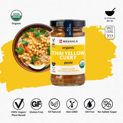 Close-up of Mekhala Yellow Curry Paste ingredients like turmeric and dried chillies.