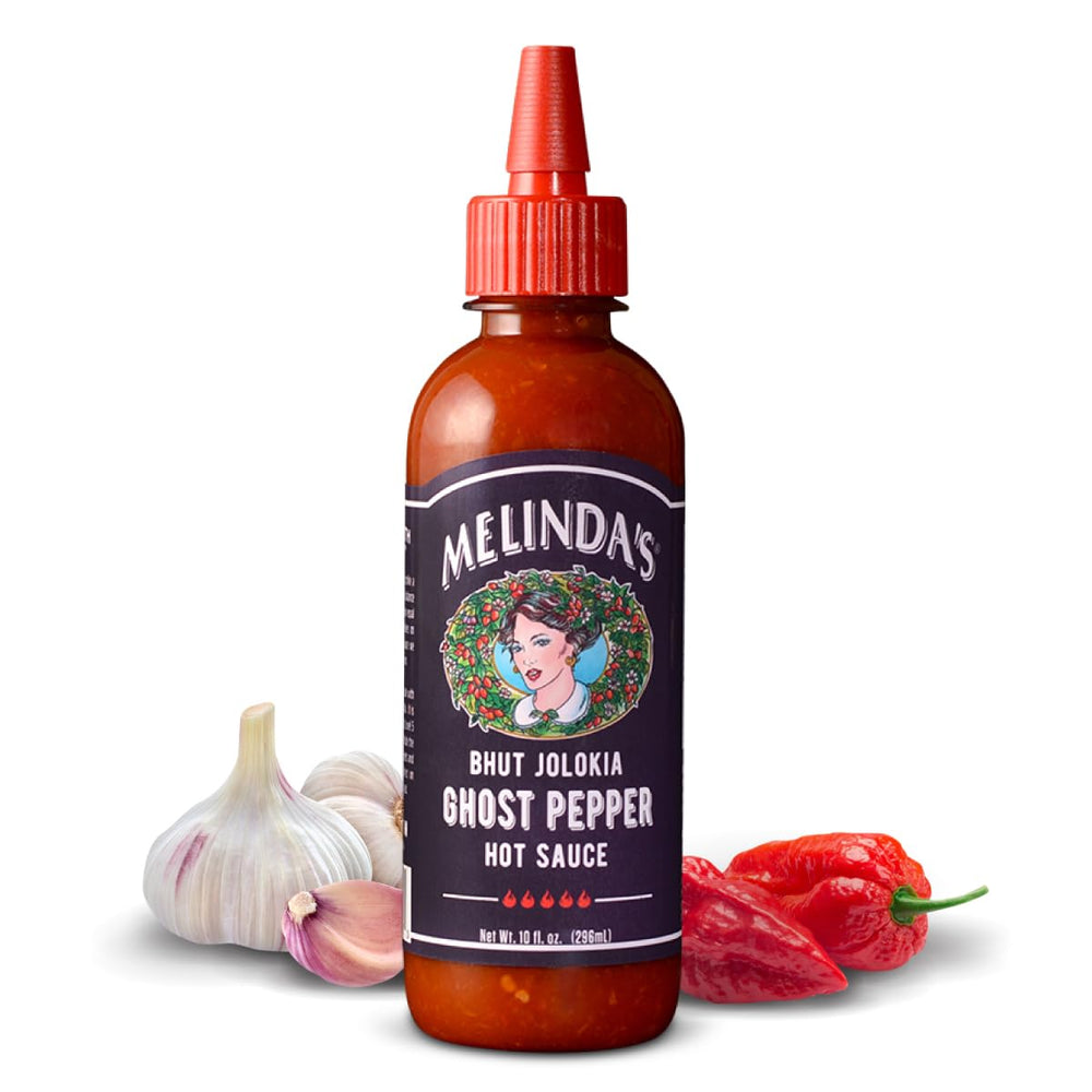 Melinda's Ghost Pepper Hot Sauce bottle on a table showing bold flavor and heat.