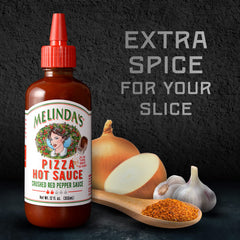 Closeup of Melinda’s Pizza Hot Sauce ingredients: garlic, onions, tomatoes, peppers.