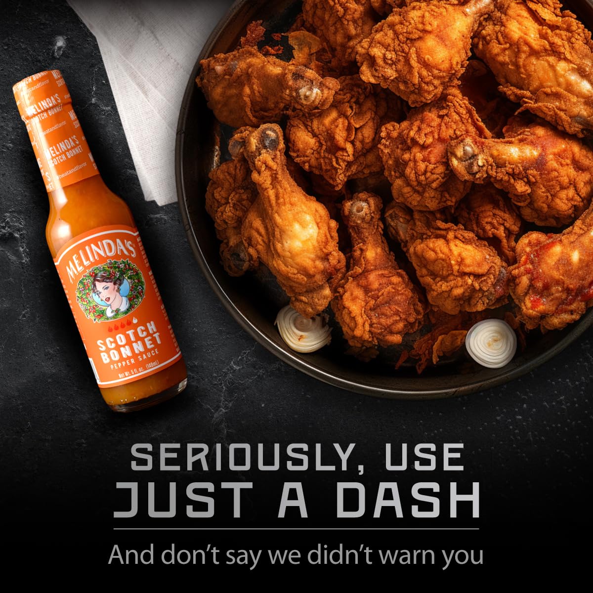 Melinda's Scotch Bonnet bottle with lime and peppers for bright finishing touch.
