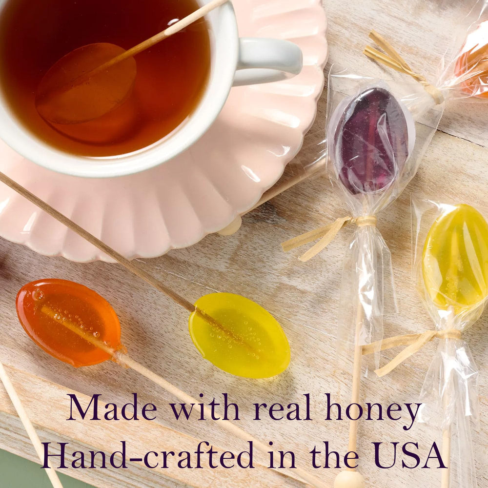 Lollipops on wooden sticks by Melville Candy add playful tea-time charm and flavor.